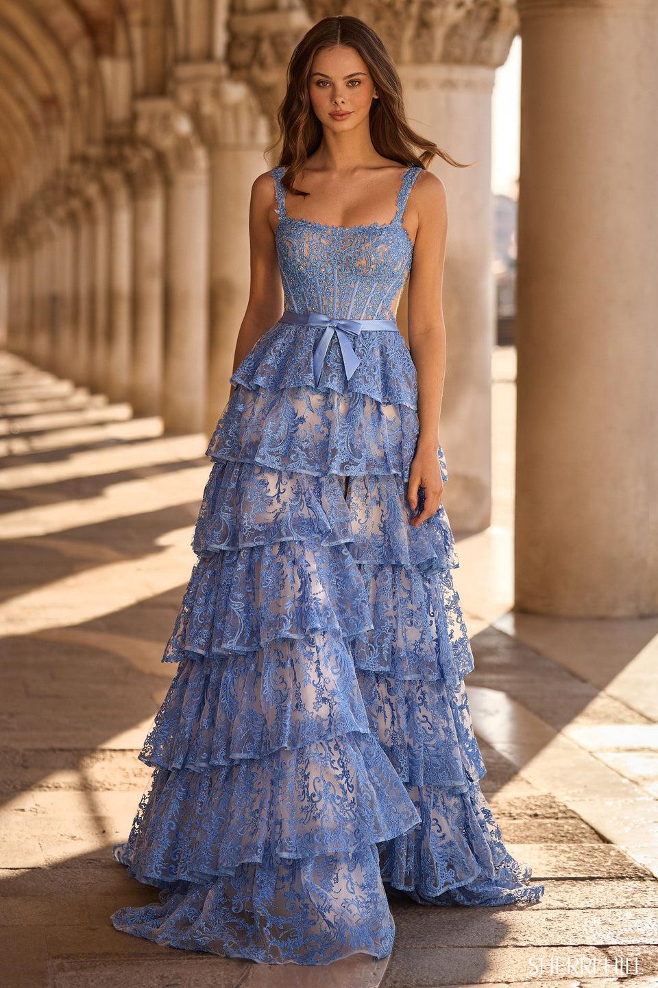 sherri hill A-line lace gown with ruffle skirt skirt slit and a bow