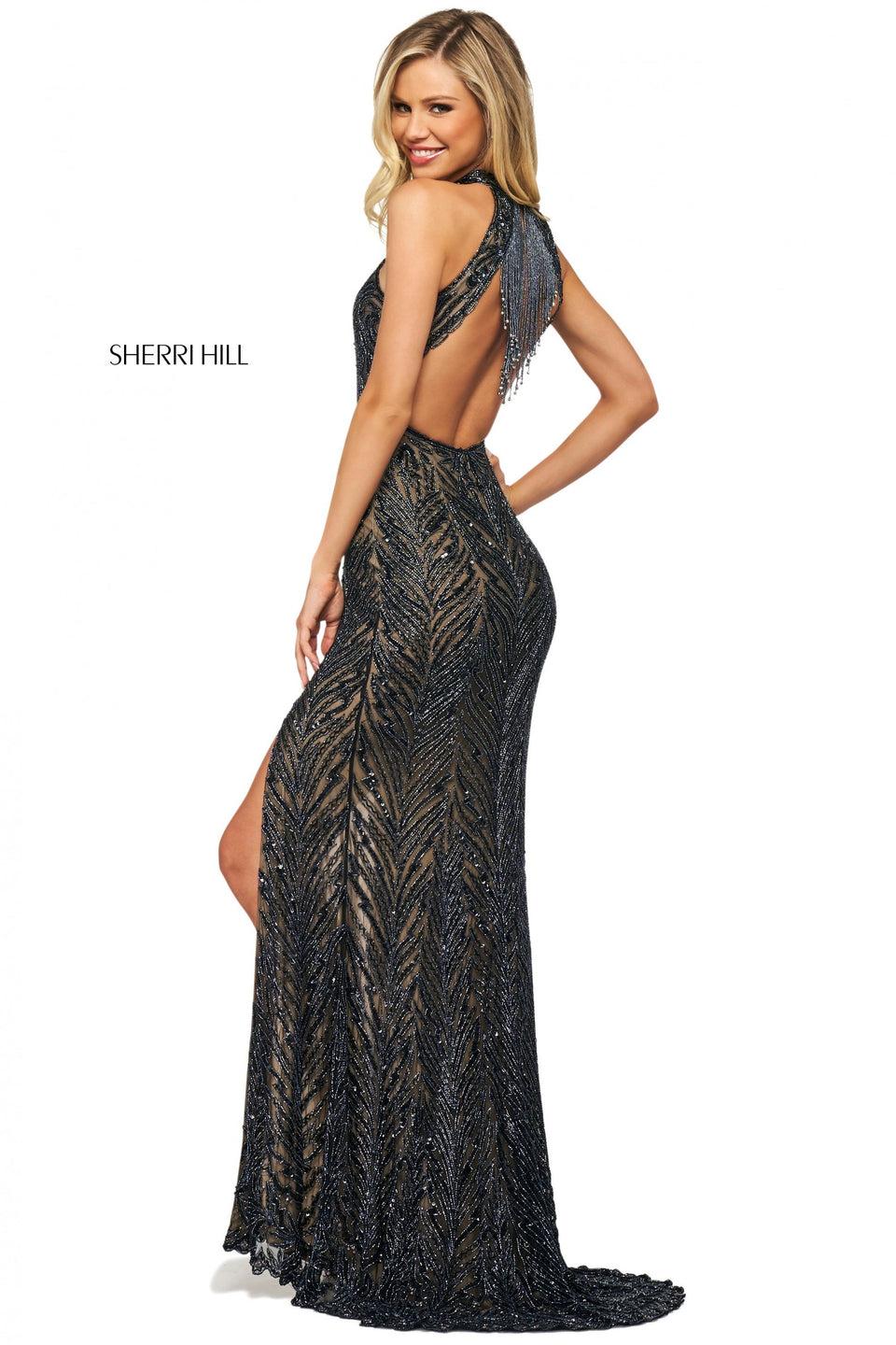 sherri hill Beaded high cut halter neckline gown with beaded fringe on an open back and a skirt slit sherri hill Beaded high cut halter neckline gown with beaded fringe on an open back and a skirt slit