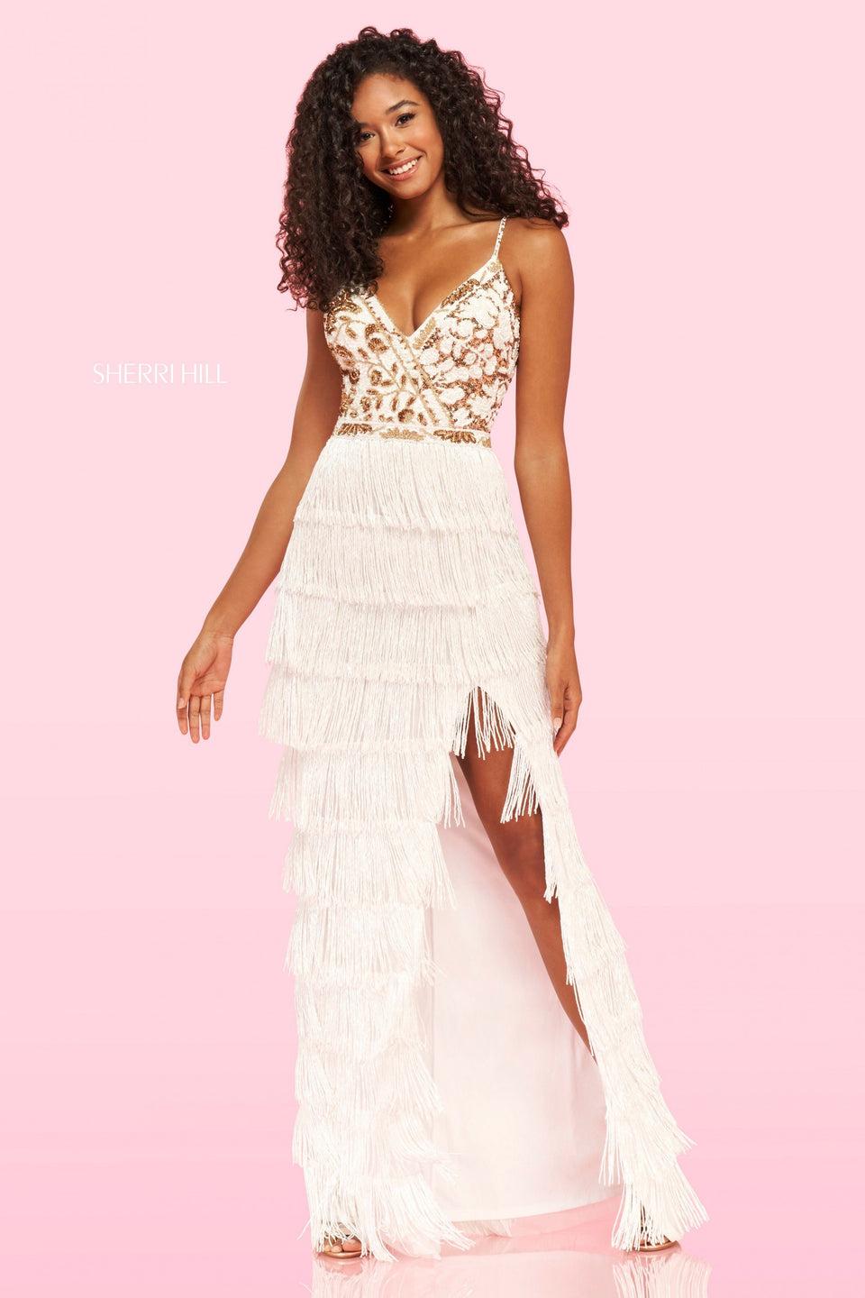 sherri hill Beaded top with a deep V neckline followed by a long fringe skirt with a high slit
