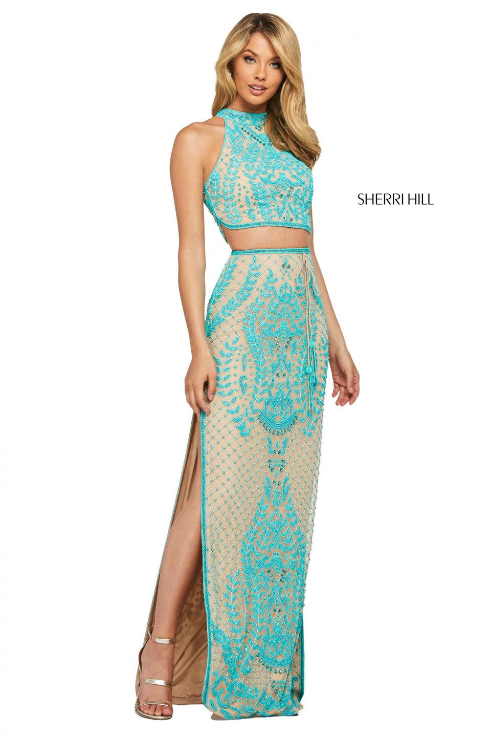 sherri hill Beaded two piece with high cut halter style bodice and skirt with tassel tie belt and double side slits sherri hill Beaded two piece with high cut halter style bodice and skirt with tassel tie belt and double side slits
