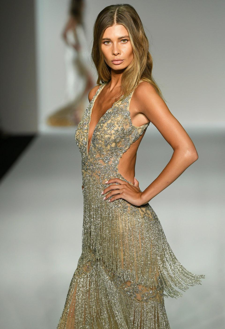sherri hill Fully beaded gown with deep V neckline fringe skirt and an open back