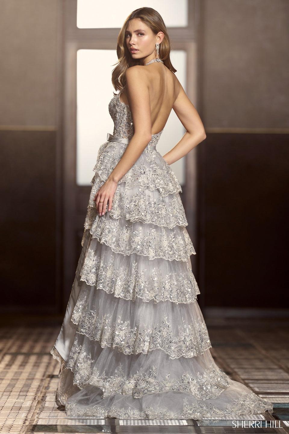 Sherri Hill Halter Tulle Sequin A-Line Gown With A Deep V Neckline And Ruffle High Slit Skirt