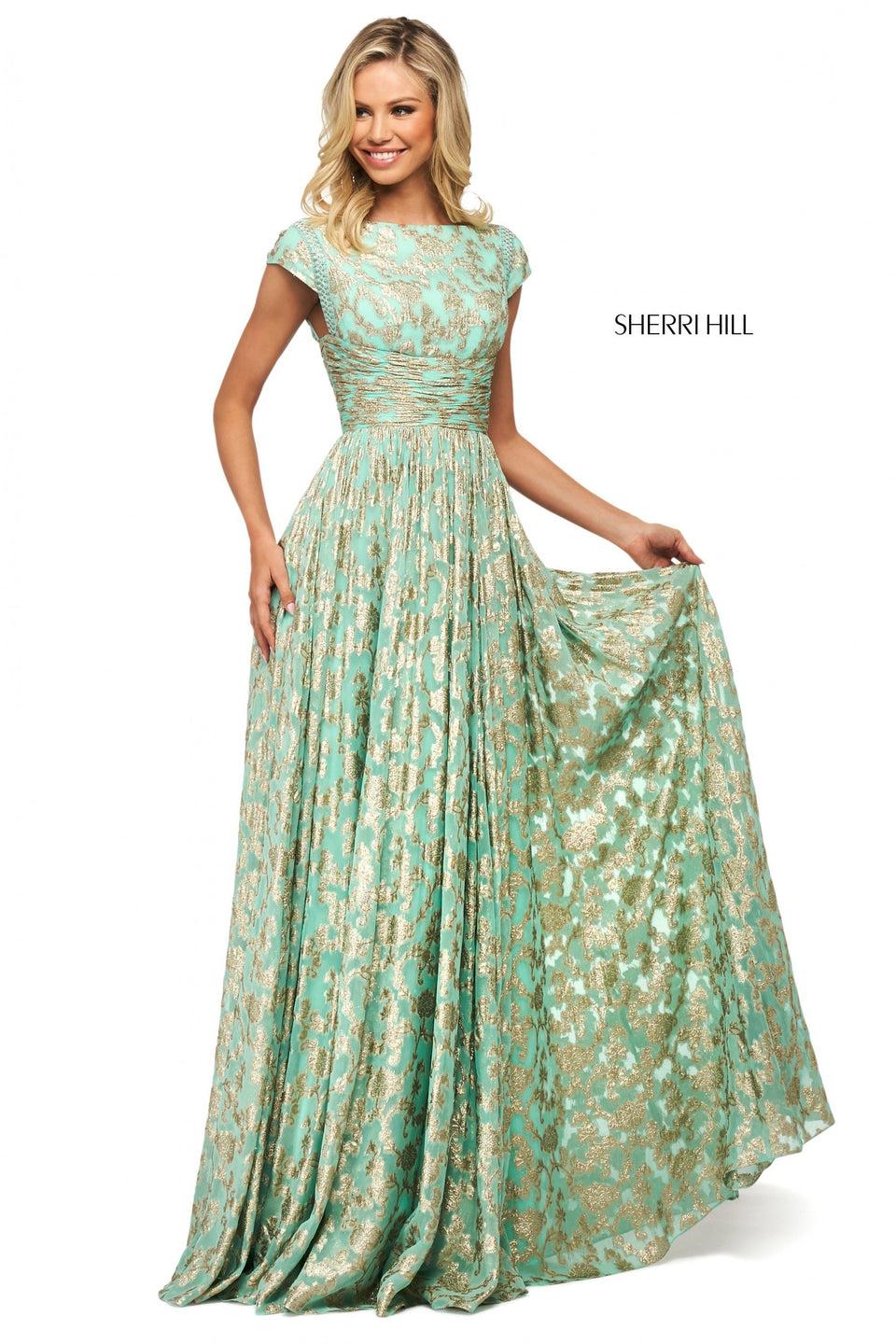 sherri hill Metallic cross dyed gown with bateau neckline cap sleeve bodice ruched waistband and tassel tie sherri hill Metallic cross dyed gown with bateau neckline cap sleeve bodice ruched waistband and tassel tie