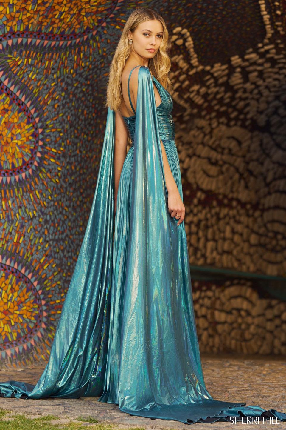 sherri hill Rich metallic pleated A-line gown with cape and skirt slit