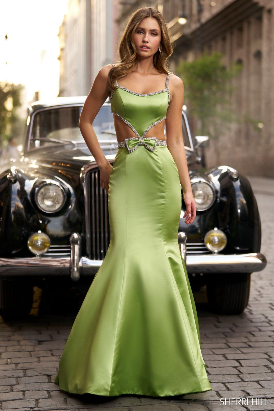 sherri hill Satin mermaid gown with cut outs bow and bead embellishments and an open back