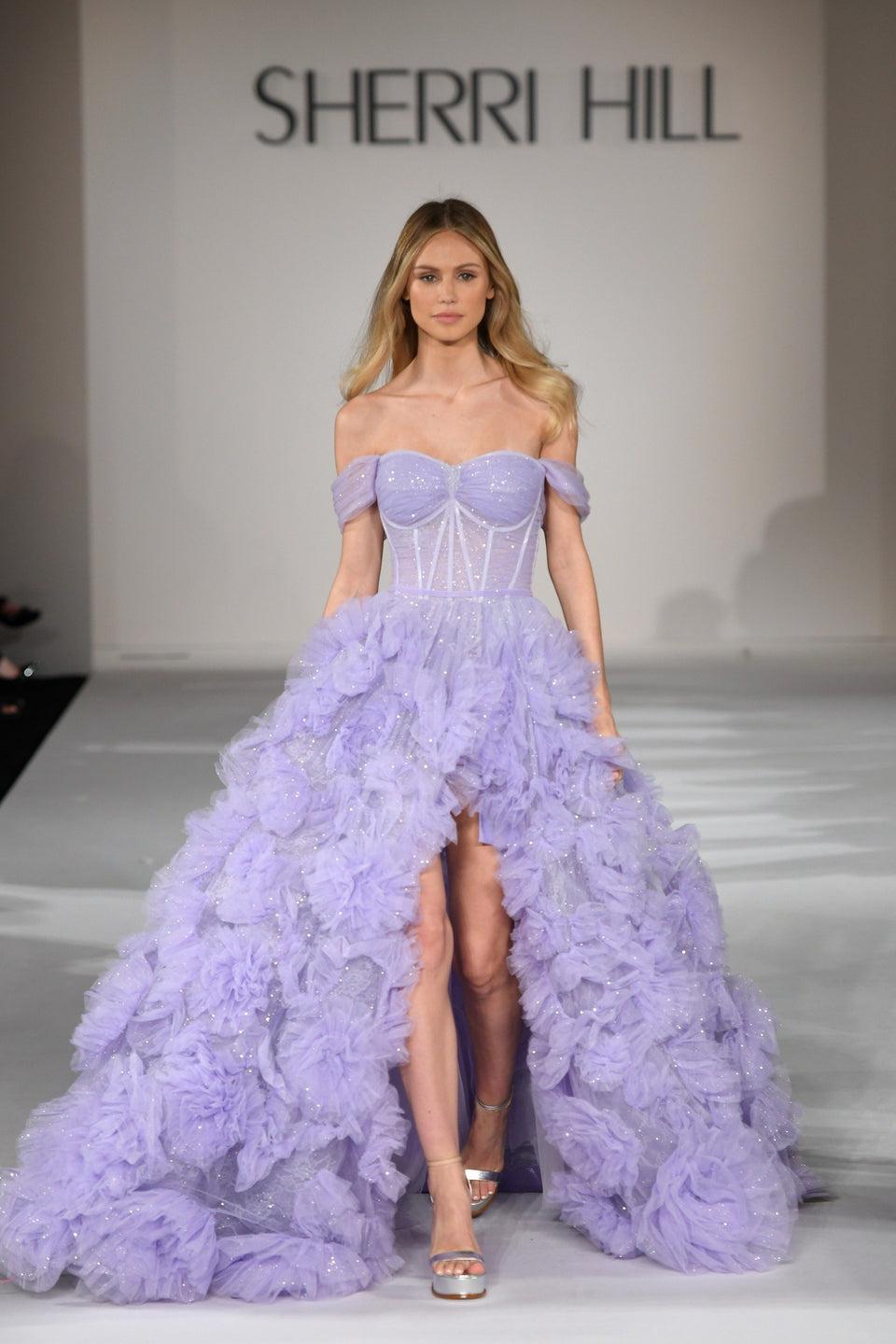 sherri hill Shimmer tulle ballgown with corset bodice off the shoulder sleeves high slit and ruffle skirt sherri hill Shimmer tulle ballgown with corset bodice off the shoulder sleeves high slit and ruffle skirt