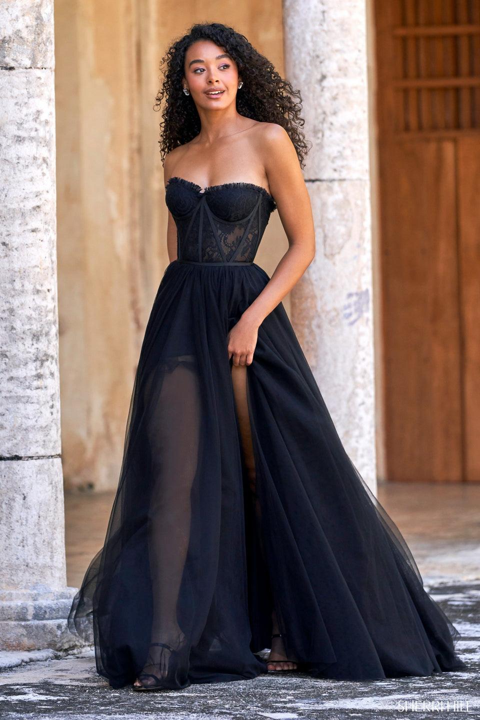 sherri hill Strapless A-line gown with corset top and tulle skirt with slit sherri hill Strapless A-line gown with corset top and tulle skirt with slit