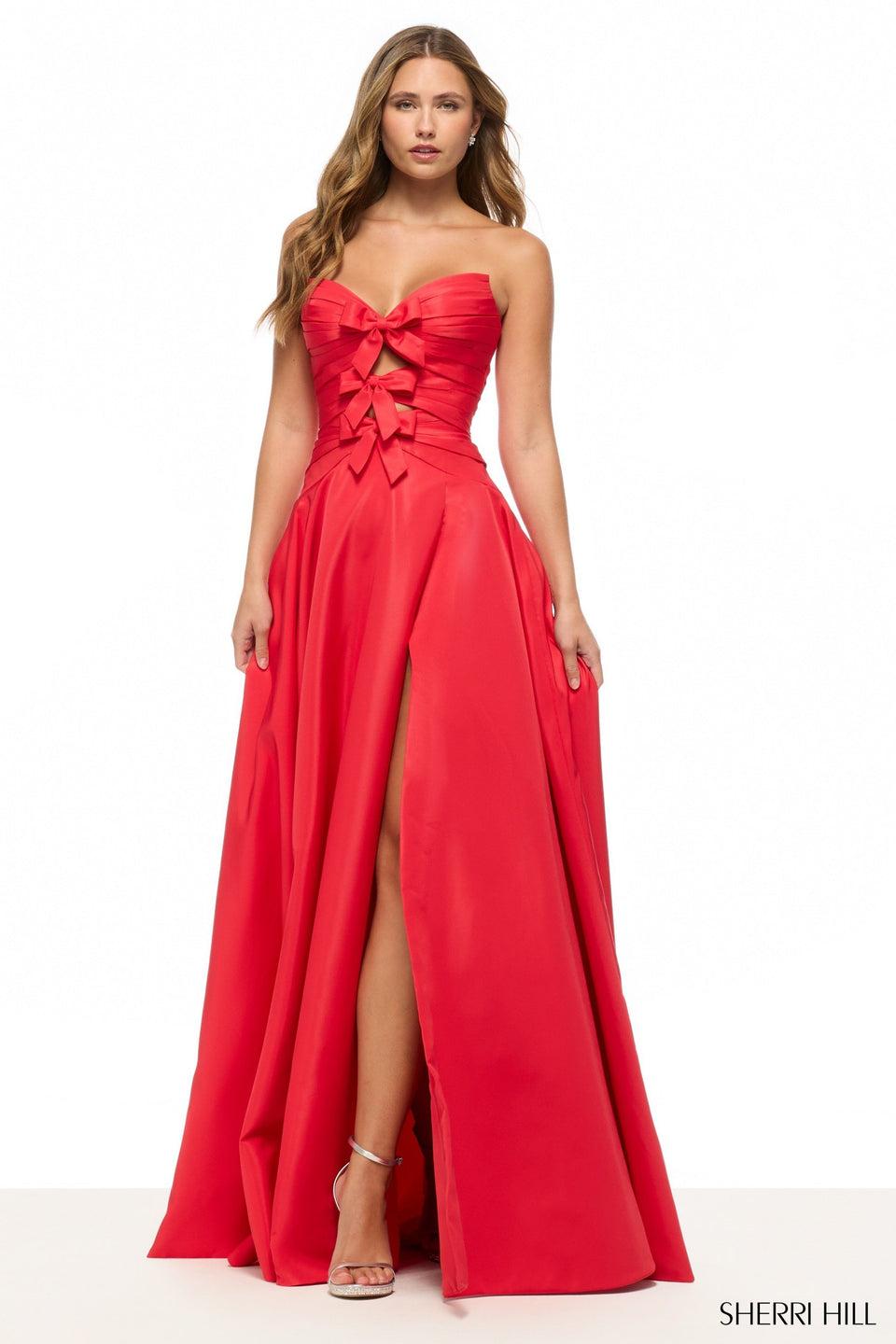 sherri hill Strapless A-line gown with cutouts bows and a skirt slit