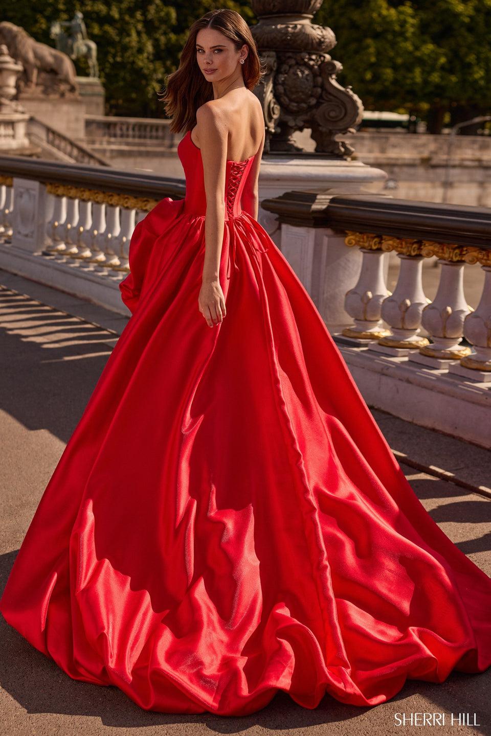 Sherri Hill Strapless Ballgown With Corset Bodice Bubble Skirt With Slit And A Rose Embellishment