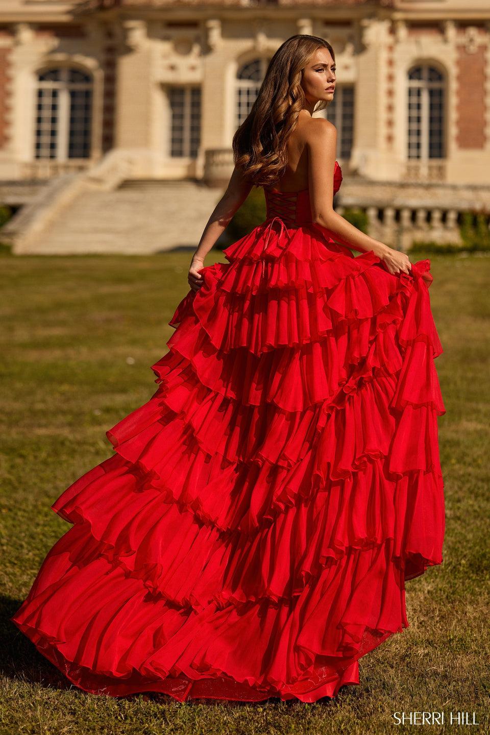 Sherri Hill Strapless Gown With A Stretch Satin Bodice Keyholes And A Chiffon Ruffle Skirt With Slit