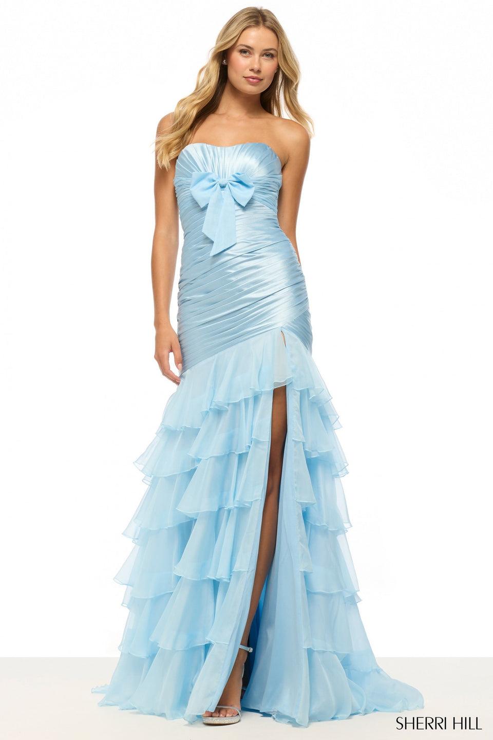sherri hill Strapless mermaid stretch satin gown with ruched bodice bow and a chiffon ruffle skirt with slit