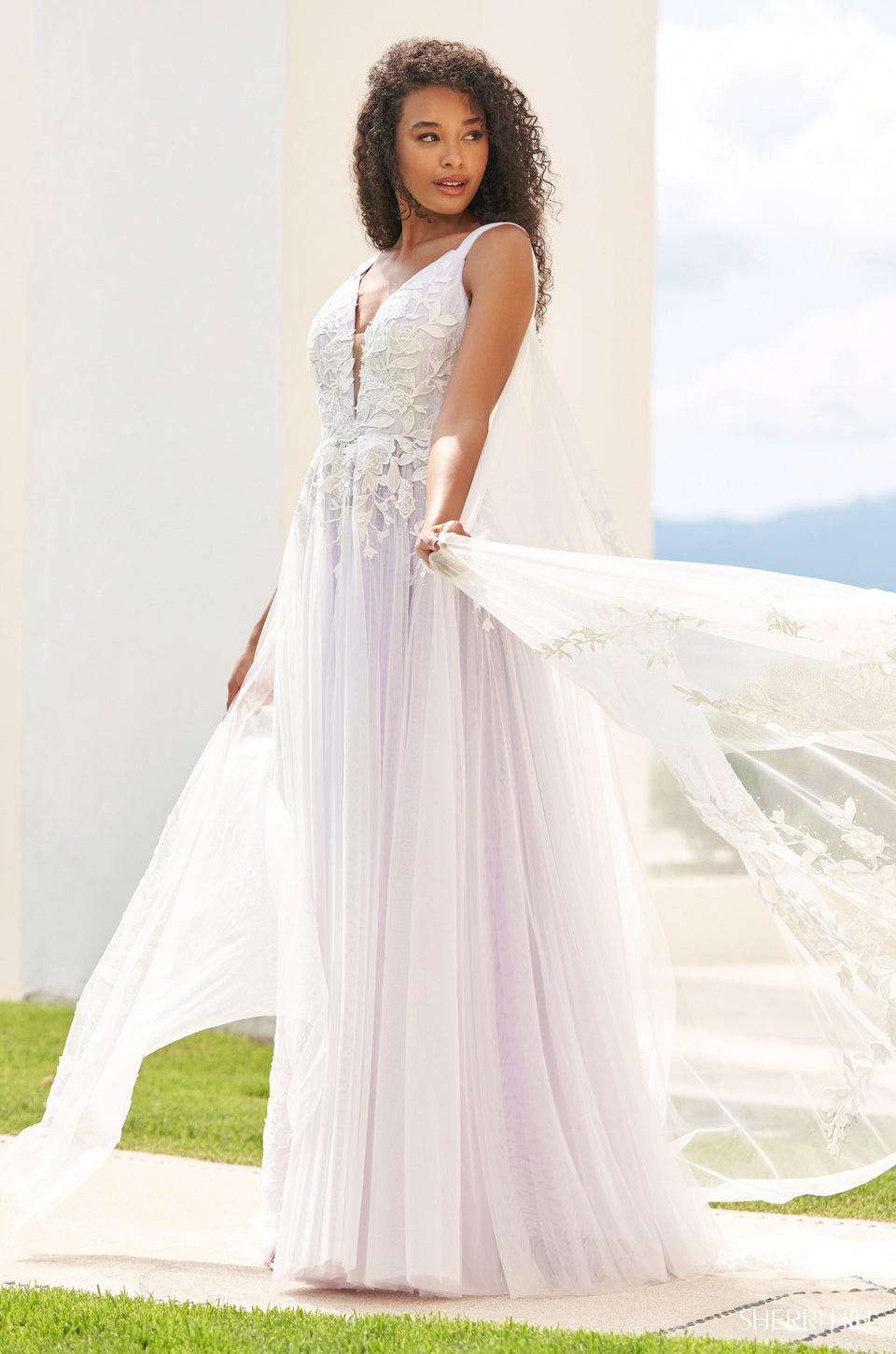 sherri hill Tulle ballgown with leaf lace embellishments deep v-cut and tulle cape