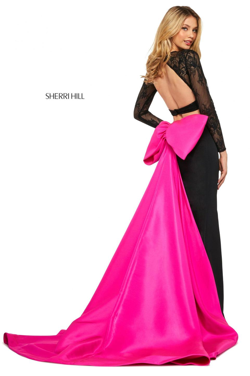 sherri hill Two piece dress with long sleeve lace open back bodice and taffeta mermaid skirt with oversized bow in the back