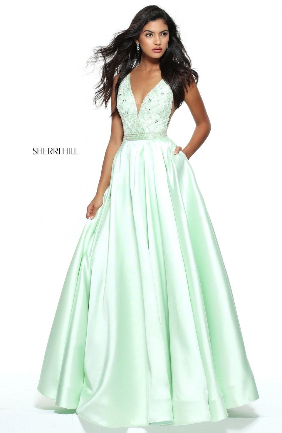 sherri hill V-neck ball gown with a beaded bodice and sheer sides